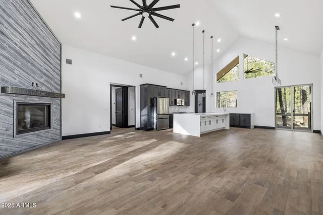 a view of a kitchen with a sink and a fireplace