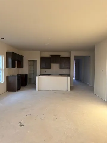 a kitchen with stainless steel appliances a sink stove and refrigerator