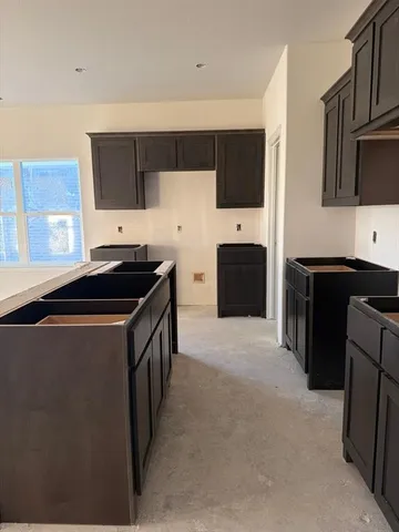 a kitchen with a sink and cabinets