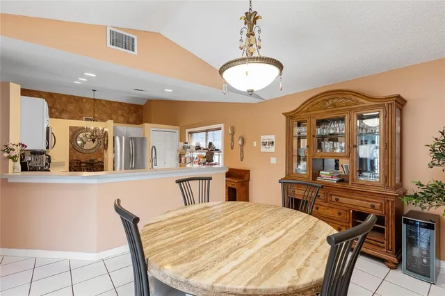 a living room with a bed furniture and a large window