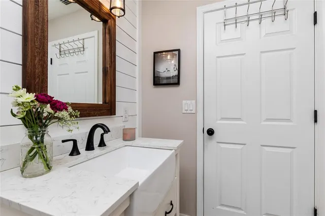 a bedroom with a bed and a flat tv screen