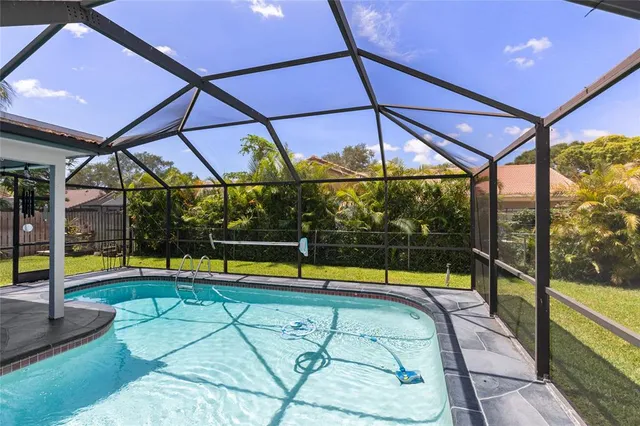 a view of a swimming pool with a patio