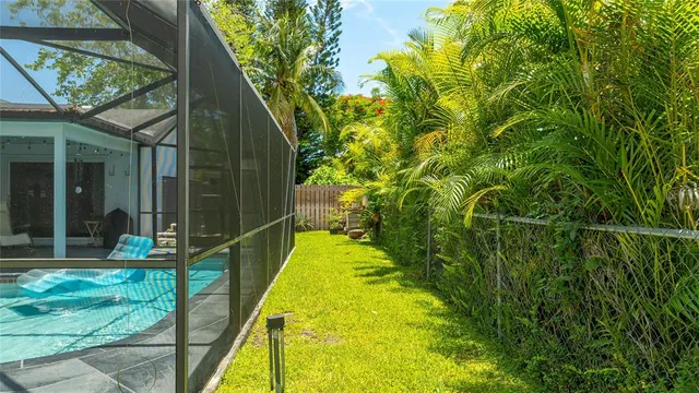 a living room with furniture ceiling fan and a rug