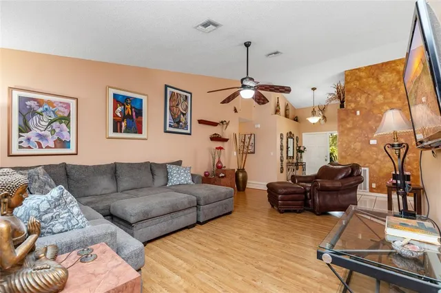 a view of a dining room with furniture and chandelier
