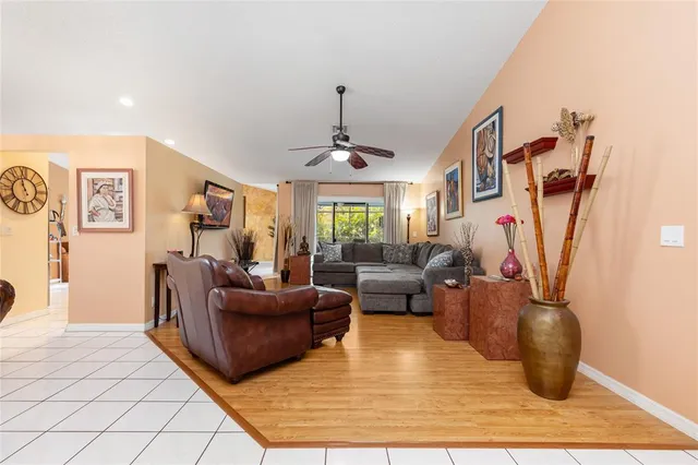 a dining room with furniture and chandelier