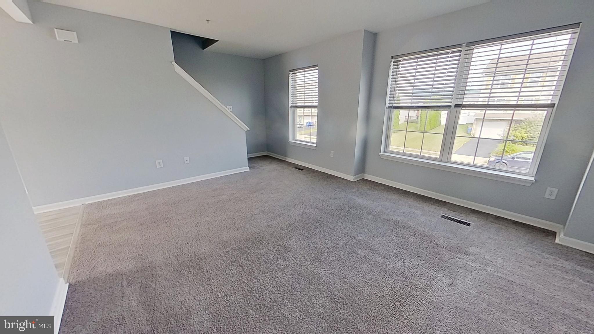 450 Fisher Drive York, PA 17404 - Photo 2 of 12 an empty room with windows