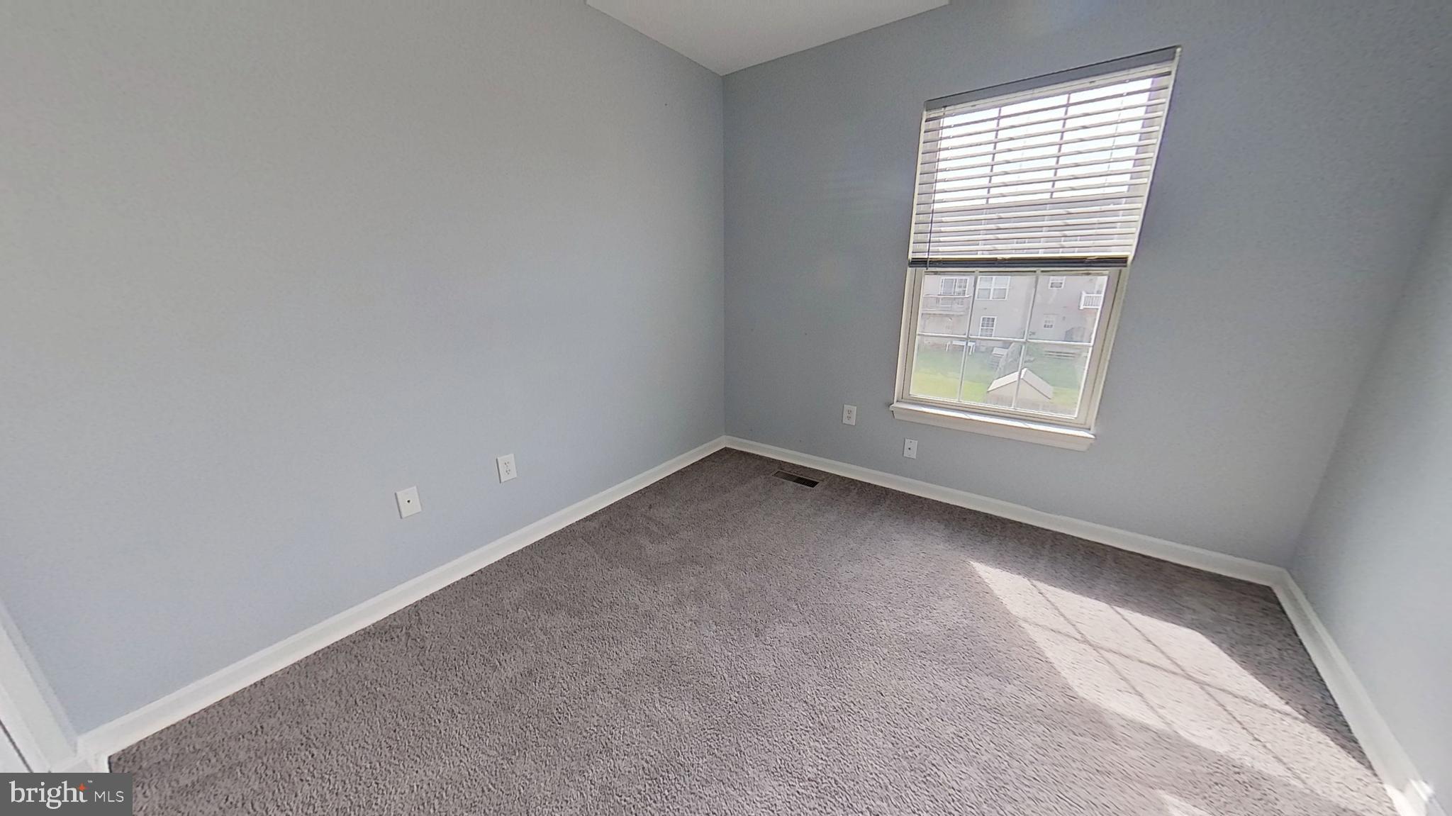 450 Fisher Drive York, PA 17404 - Photo 8 of 12 an empty room with a window