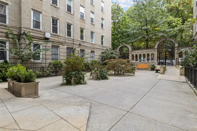 a view of a building with potted plants