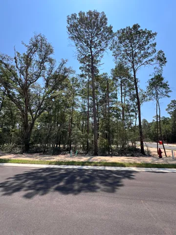 a view of swimming pool with outdoor seating and yard