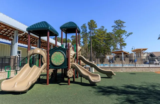 a view of a patio with table and chairs