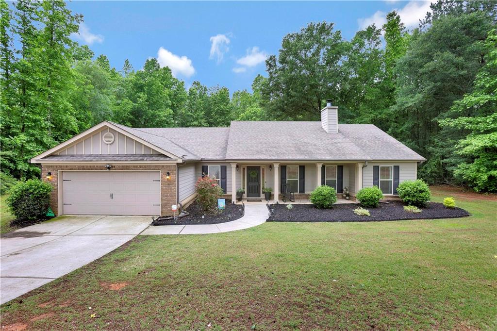 237 Arnold Road Southeast Statham, GA 30666 - Photo 1 of 1 a front view of a house with garden