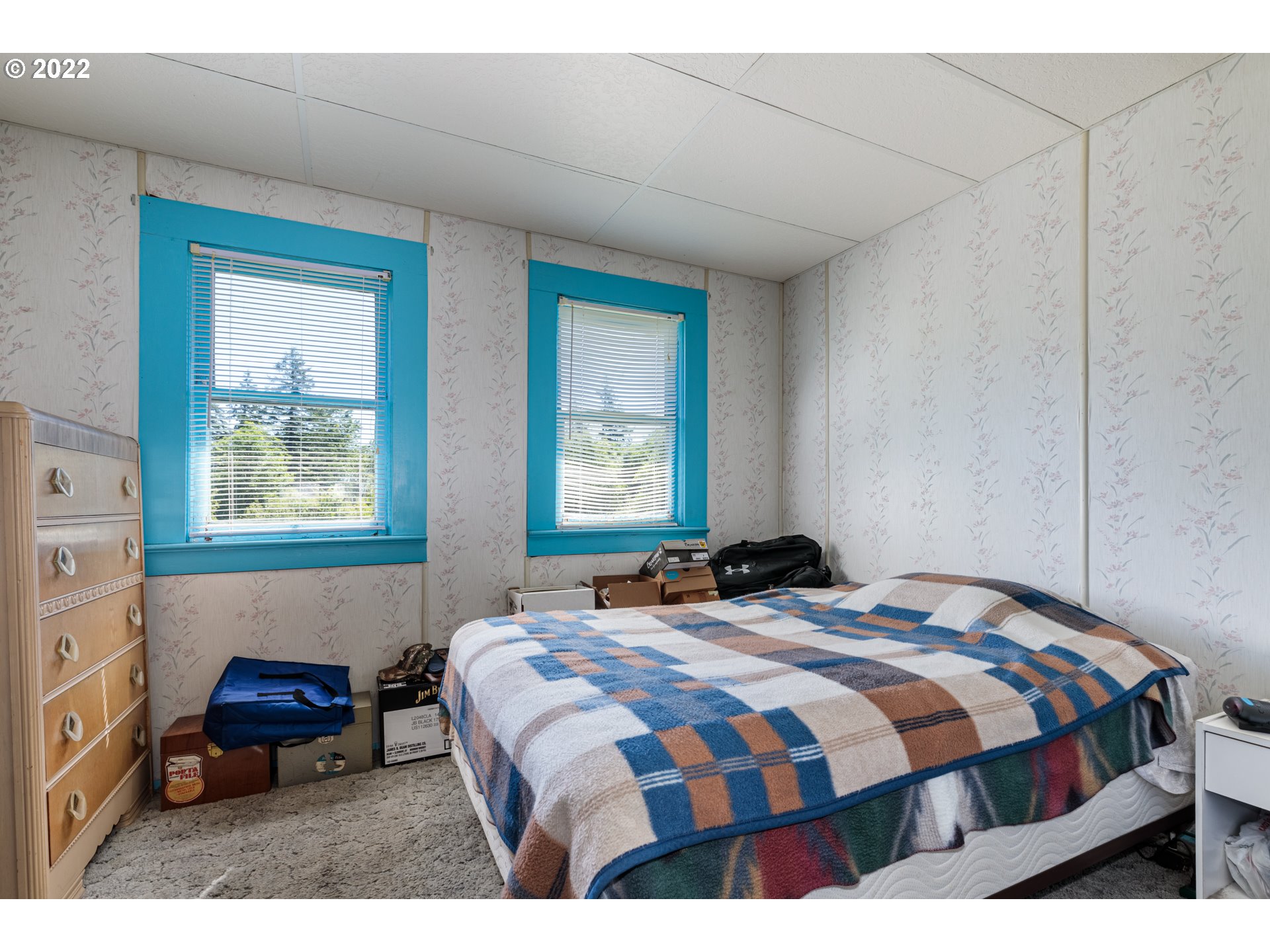 67954 Andy Thomas Road Rainier, OR 97048 - Photo 6 of 14 a bedroom with a bed two windows and painting on the wall