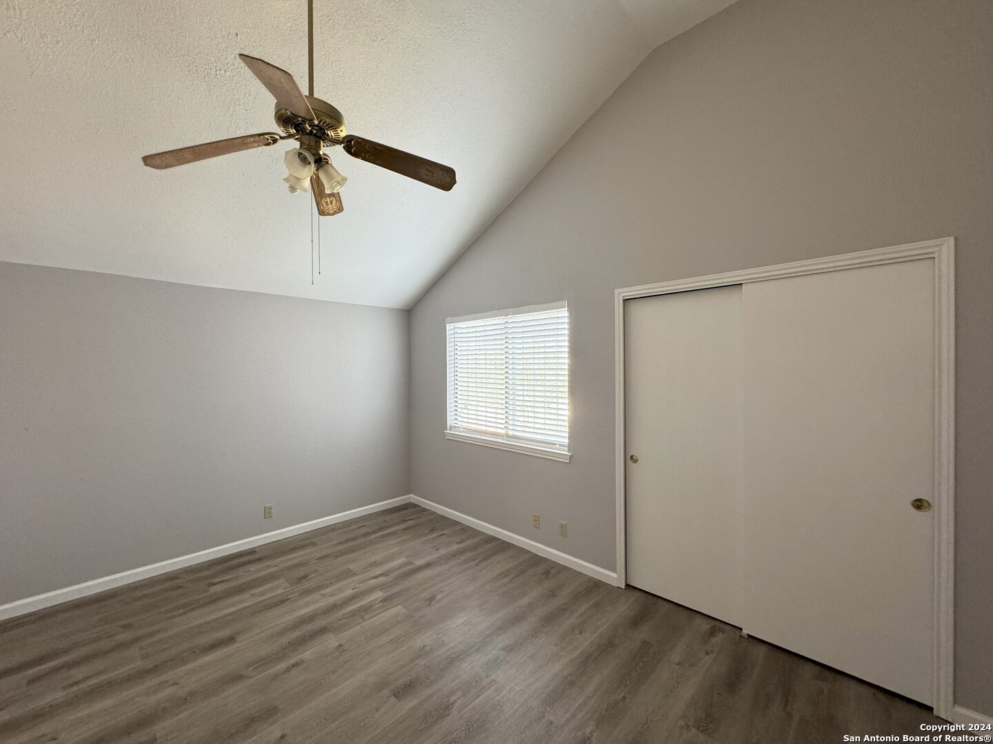 5939 Heather View San Antonio, TX 78249 - Photo 17 of 31 an empty room with a window and a fan