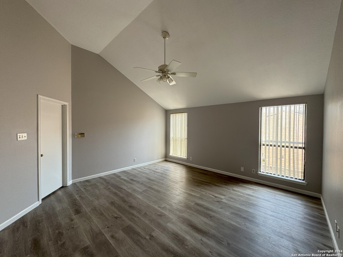5939 Heather View San Antonio, TX 78249 - Photo 18 of 31 wooden floor in an empty room with a window