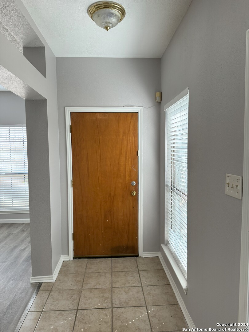 5939 Heather View San Antonio, TX 78249 - Photo 2 of 31 an empty room with windows