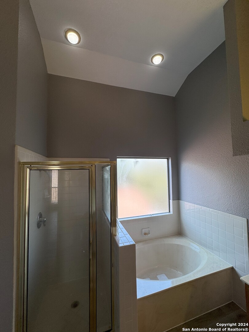 5939 Heather View San Antonio, TX 78249 - Photo 22 of 31 a bathroom with a bathtub