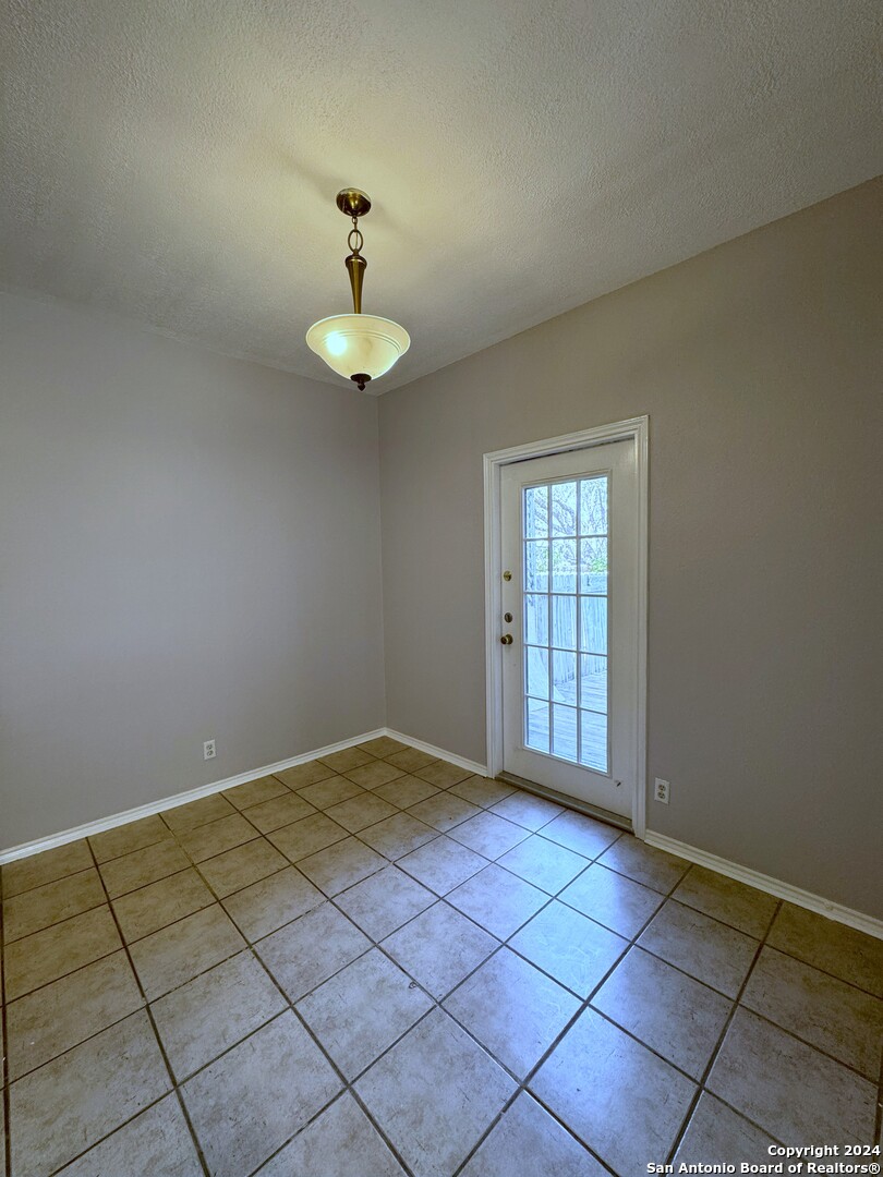 5939 Heather View San Antonio, TX 78249 - Photo 7 of 31 a view of an empty room with a window