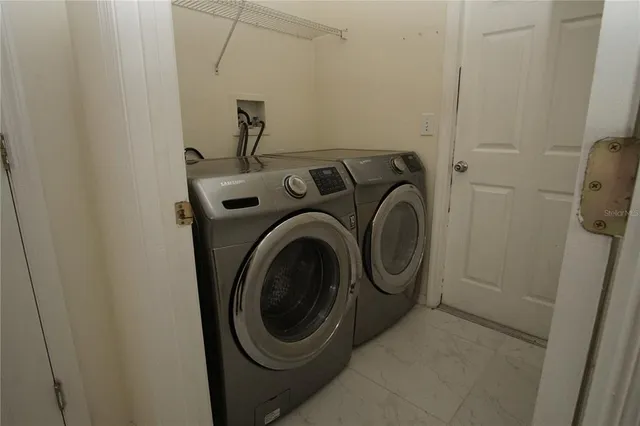 a utility room with dryer and washer
