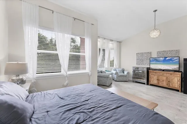 a living room with furniture and windows
