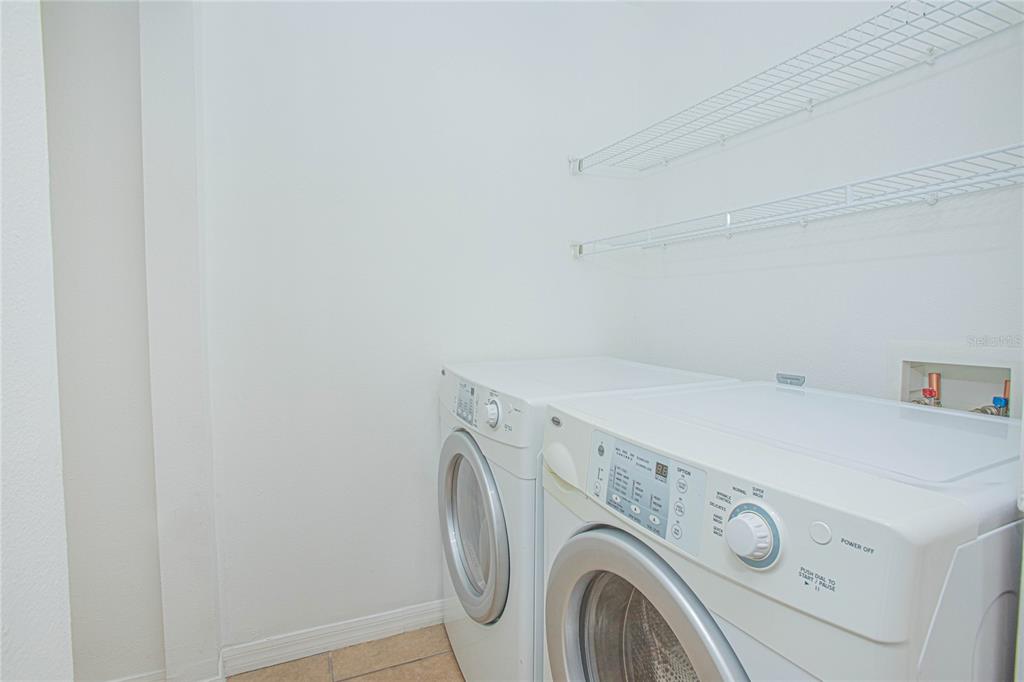 6468 South Goldenrod Road, Unit 34B Orlando, FL 32822 - Photo 17 of 34 a utility room with dryer and washer