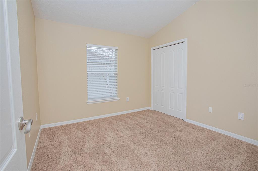6468 South Goldenrod Road, Unit 34B Orlando, FL 32822 - Photo 18 of 34 a view of an empty room with a window