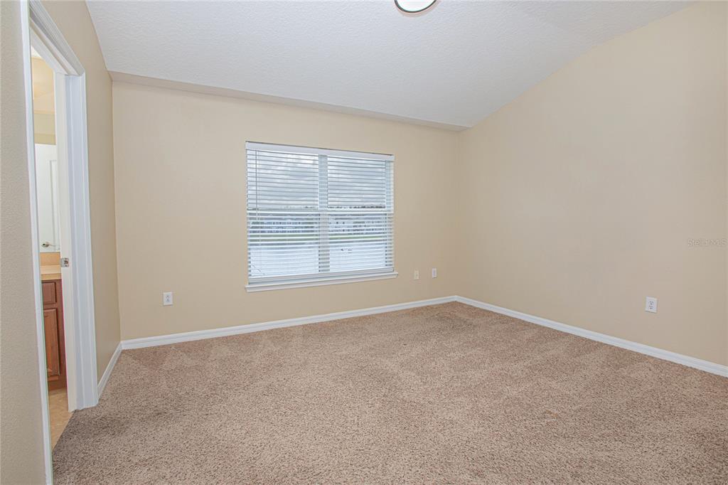 6468 South Goldenrod Road, Unit 34B Orlando, FL 32822 - Photo 22 of 34 an empty room with windows