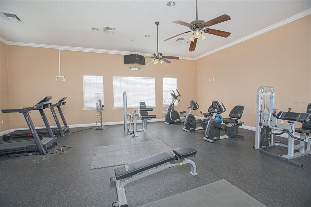 6468 South Goldenrod Road, Unit 34B Orlando, FL 32822 - Photo 23 of 34 a view of a room with gym equipment