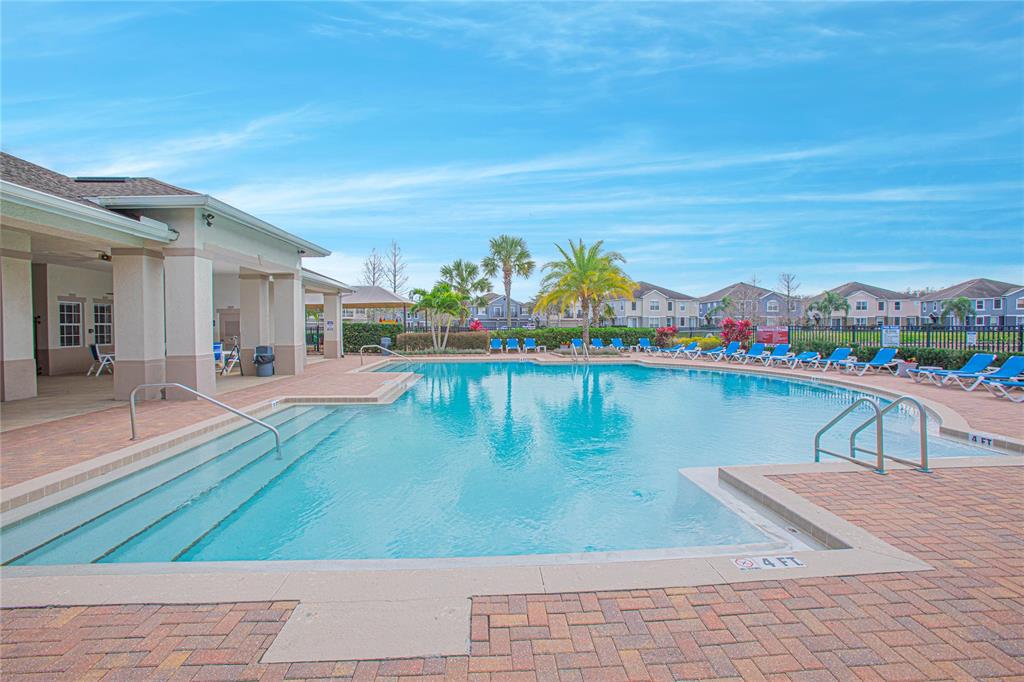 6468 South Goldenrod Road, Unit 34B Orlando, FL 32822 - Photo 25 of 34 a view of swimming pool with outdoor seating and plants