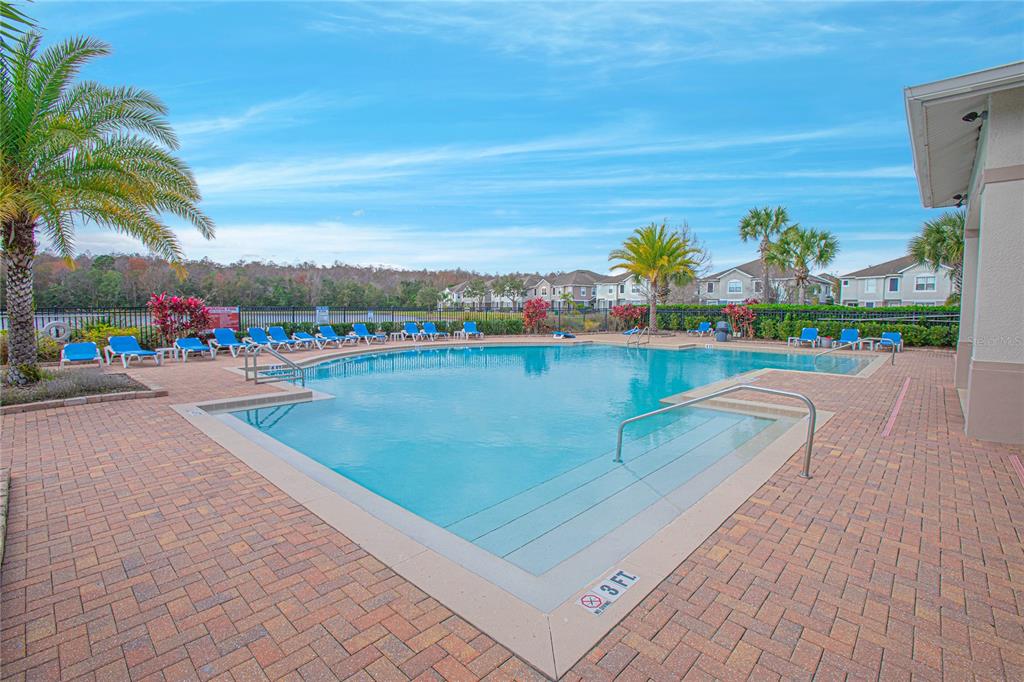 6468 South Goldenrod Road, Unit 34B Orlando, FL 32822 - Photo 27 of 34 a view of swimming pool with a table and chairs