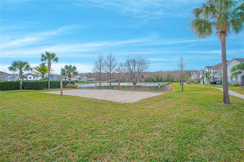 6468 South Goldenrod Road, Unit 34B Orlando, FL 32822 - Photo 28 of 34 a view of a golf course with a lake