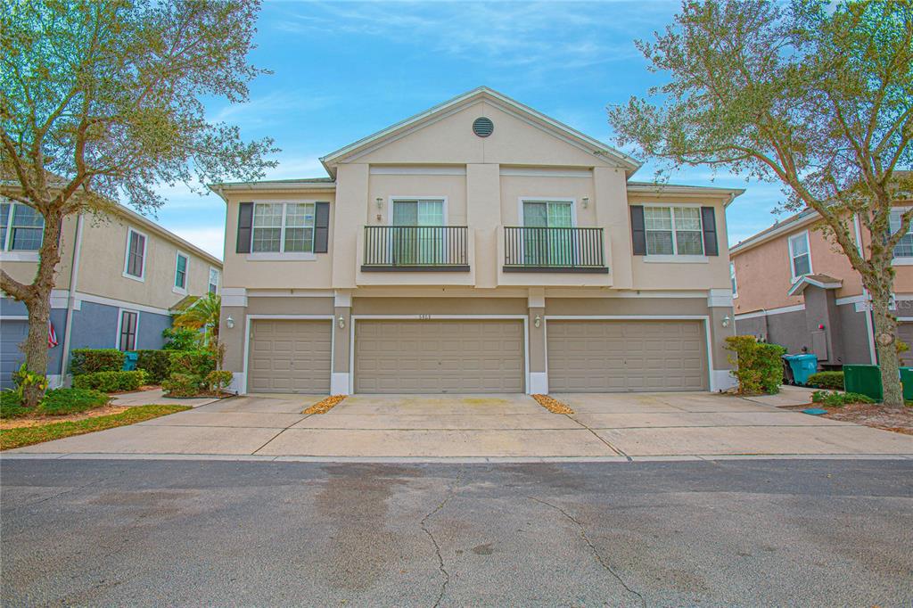 6468 South Goldenrod Road, Unit 34B Orlando, FL 32822 - Photo 3 of 34 a view of yellow house with a large windows and large tree