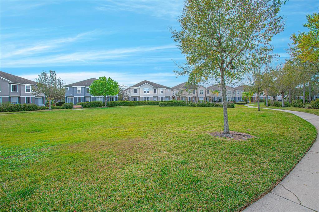 6468 South Goldenrod Road, Unit 34B Orlando, FL 32822 - Photo 32 of 34 a view of a trees with a yard