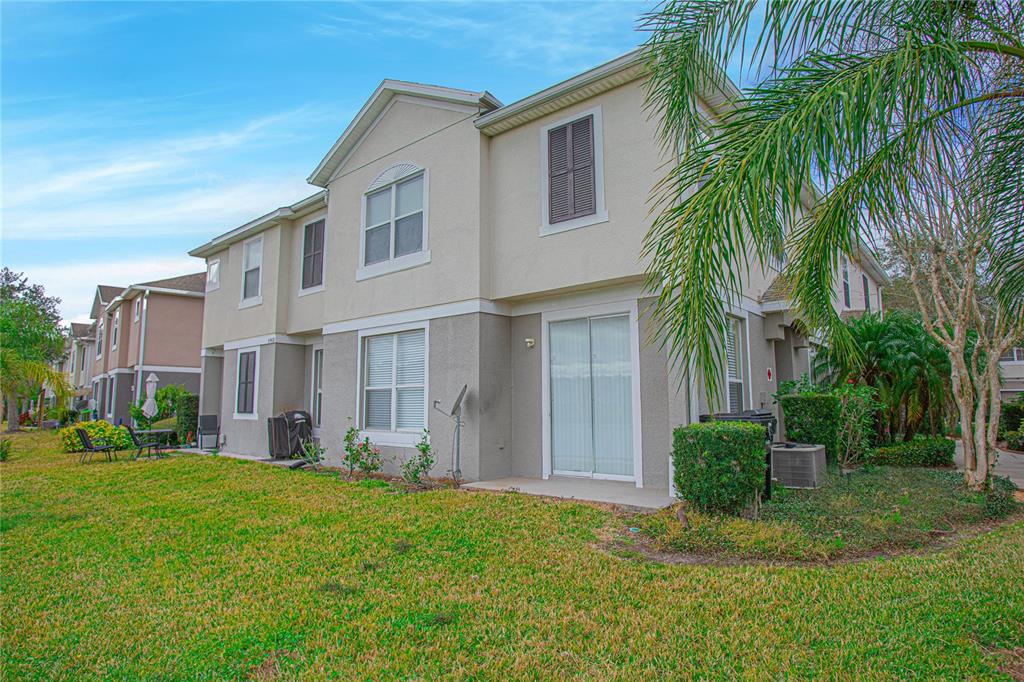 6468 South Goldenrod Road, Unit 34B Orlando, FL 32822 - Photo 4 of 34 a view of a yard in front of house