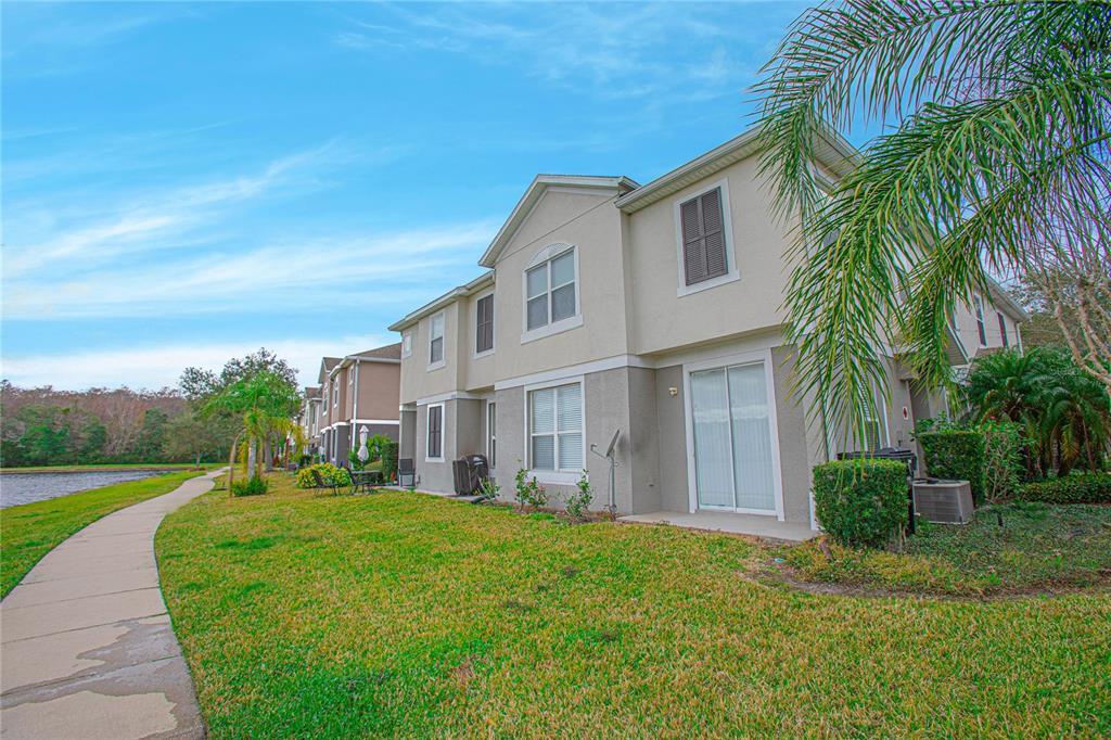 6468 South Goldenrod Road, Unit 34B Orlando, FL 32822 - Photo 5 of 34 a view of a house with a yard