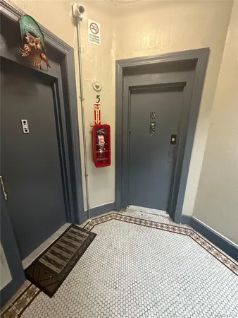 a bedroom with a bed and a mirror