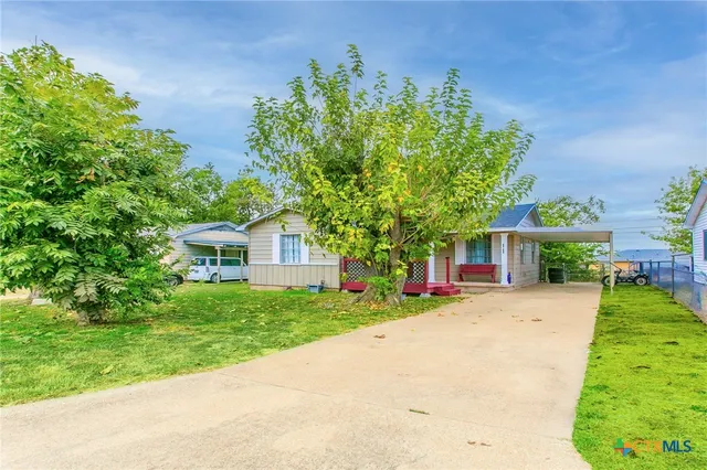 front view of a house with a yard