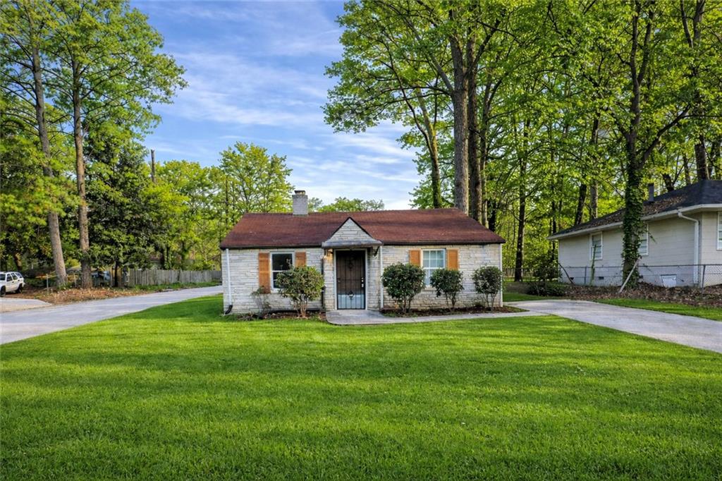 335 Mount Zion Road Southwest Atlanta, GA 30354 - Photo 1 of 11 a view of a house with a garden
