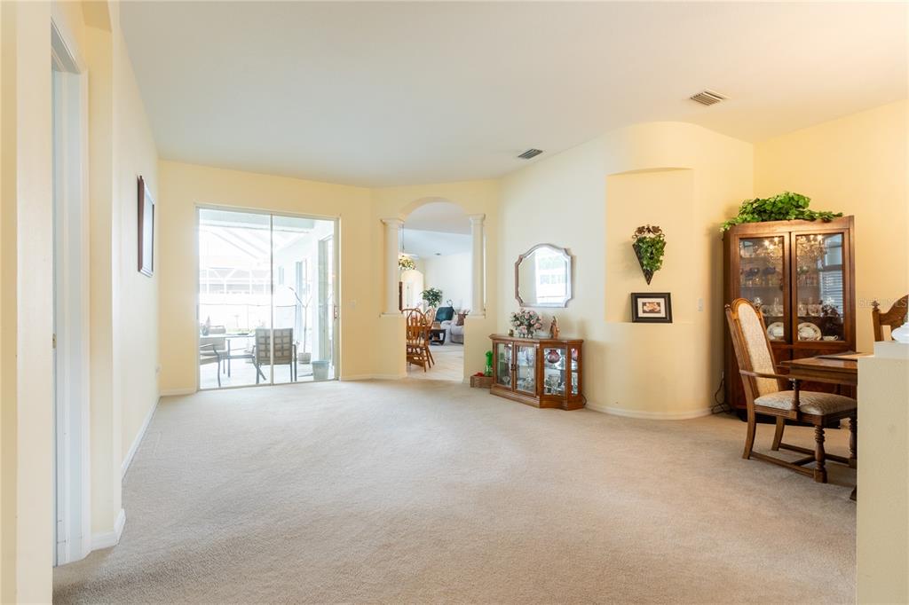 1812 Flower Branch Way Valrico, FL 33594 - Photo 6 of 42 a view of a room with furniture and a large window