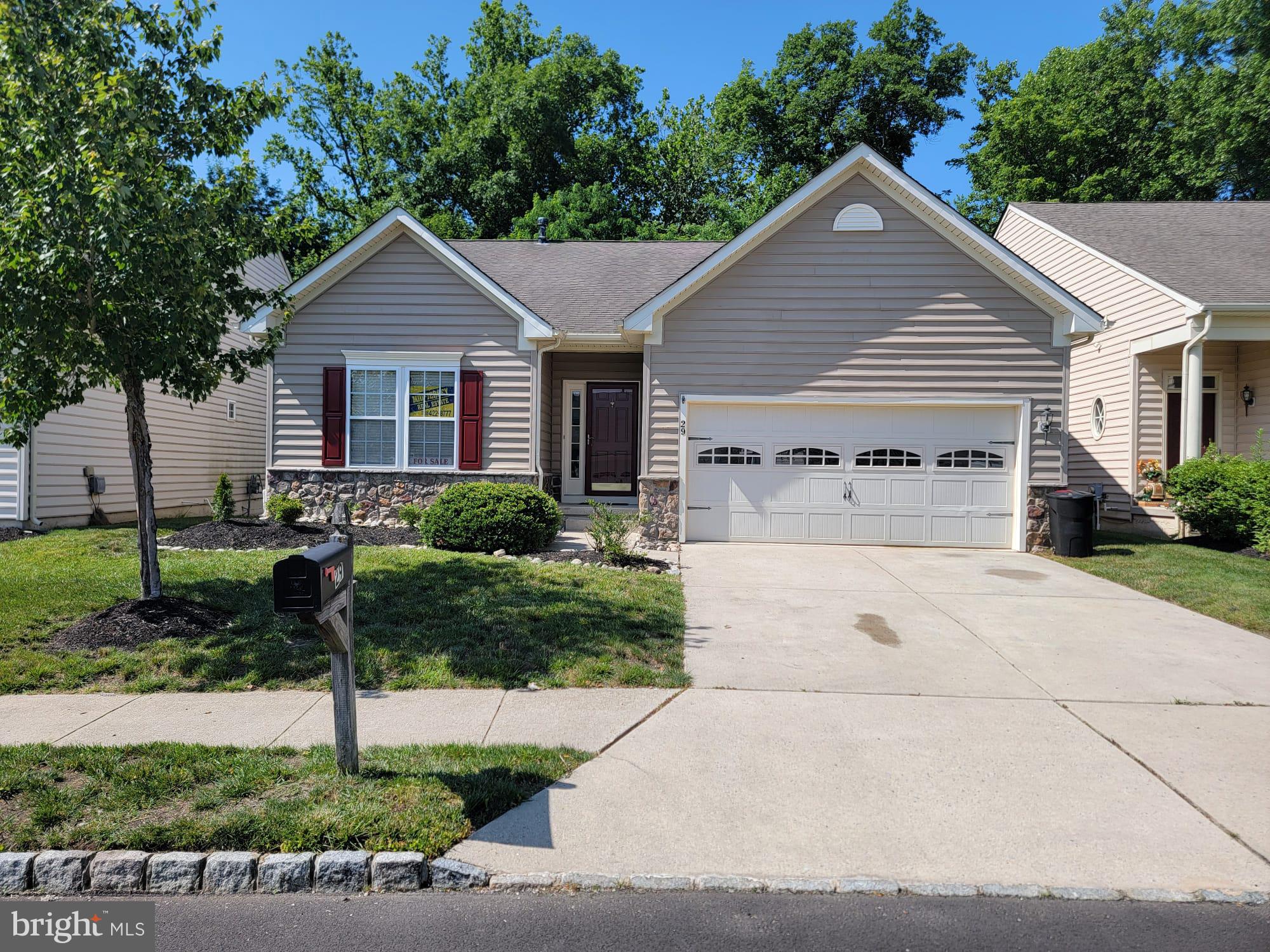 29 Hearthstone Boulevard Pemberton, NJ 08068 - Photo 15 of 17 a front view of a house with garage