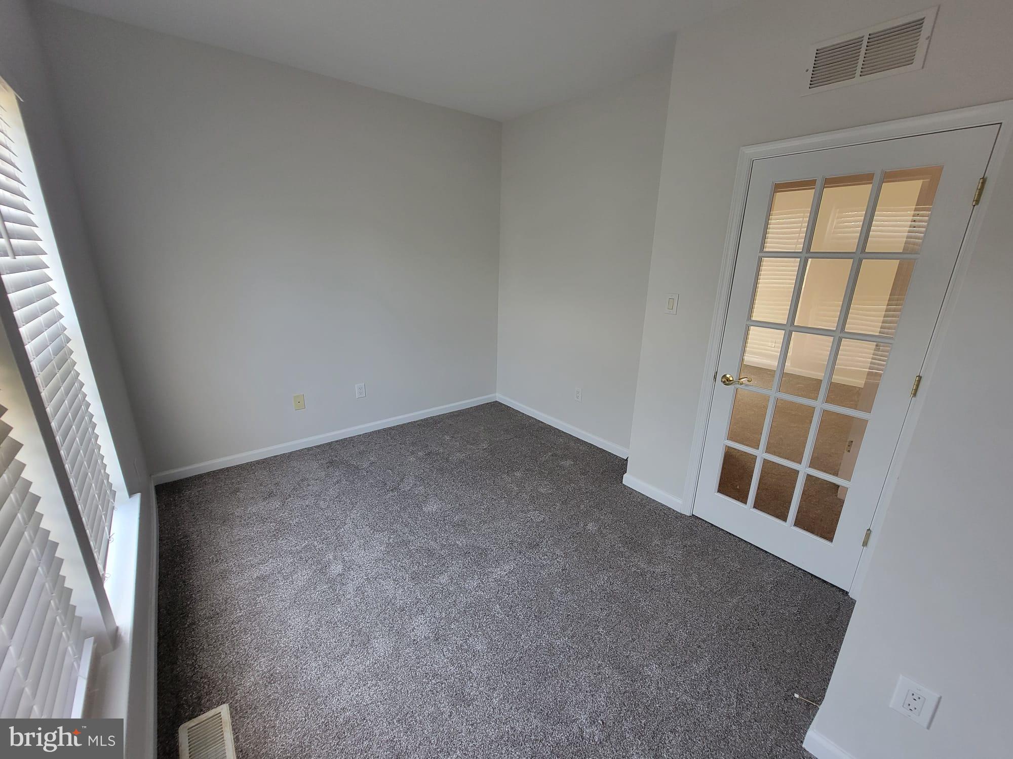 29 Hearthstone Boulevard Pemberton, NJ 08068 - Photo 4 of 17 an empty room with windows