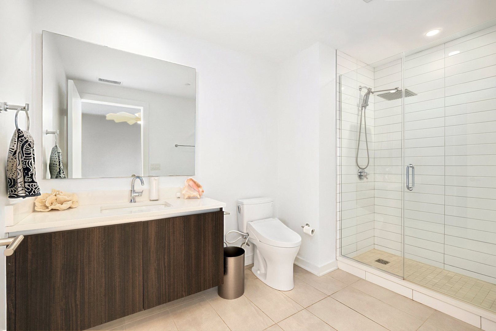 1648 West Division Street, Unit 703 Chicago, IL 60622 - Photo 24 of 41 a bathroom with a sink toilet a mirror and shower