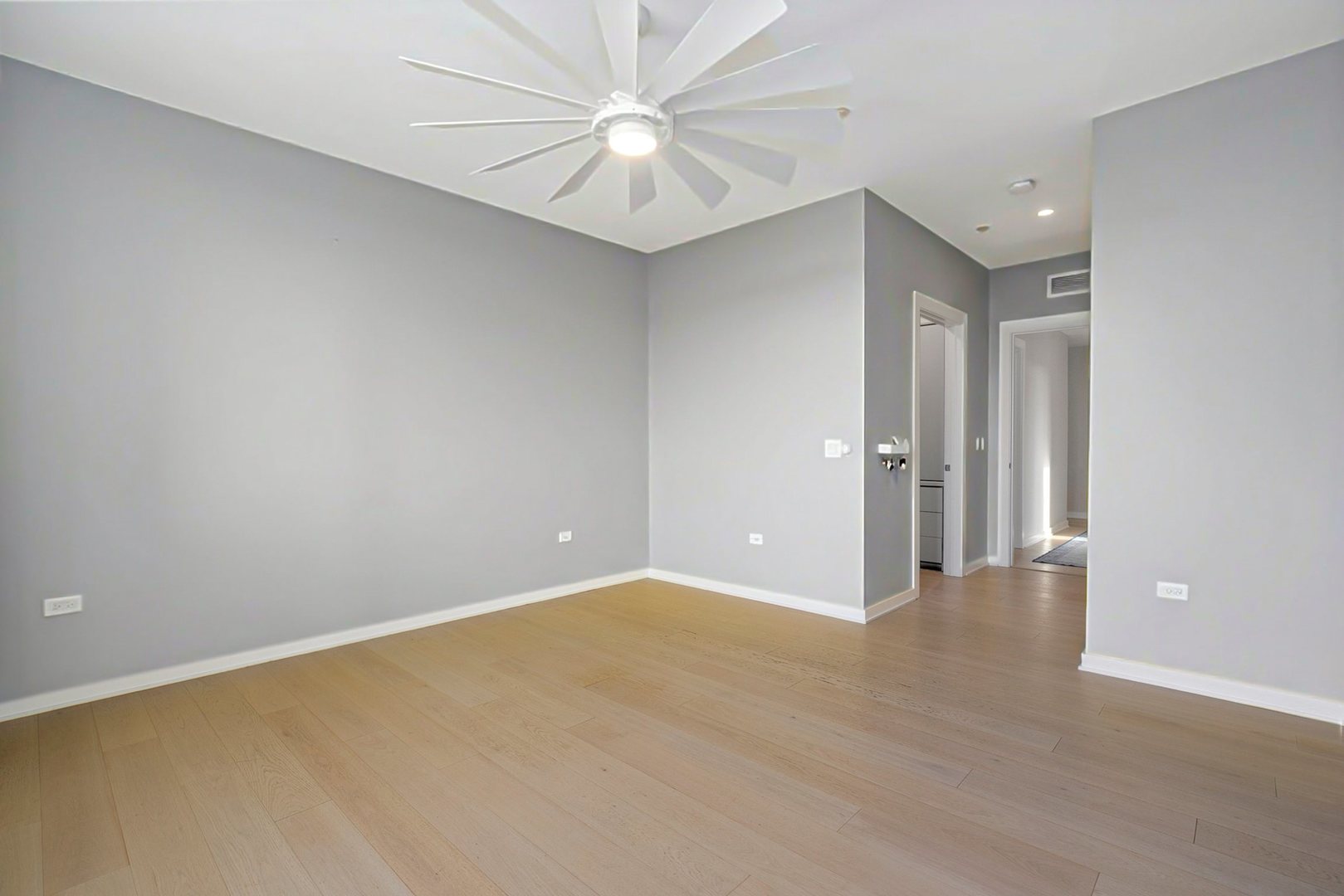 1648 West Division Street, Unit 703 Chicago, IL 60622 - Photo 28 of 41 a view of an empty room with a ceiling fan