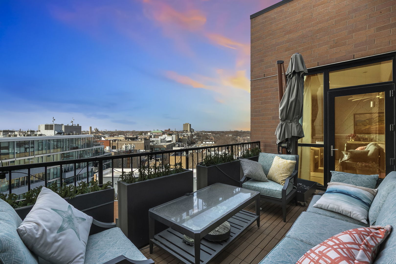 1648 West Division Street, Unit 703 Chicago, IL 60622 - Photo 10 of 41 a view of a balcony with couches and wooden floor