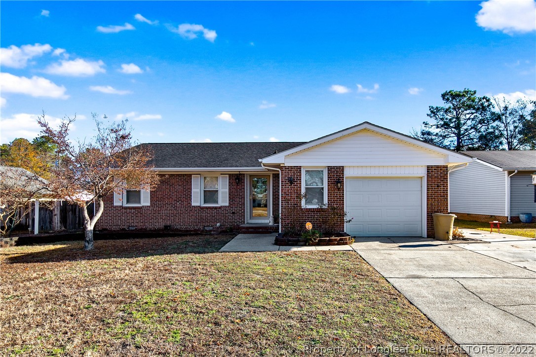 211 Duncan Road Spring Lake, NC 28390 - Photo 1 of 46 a front view of a house with a yard