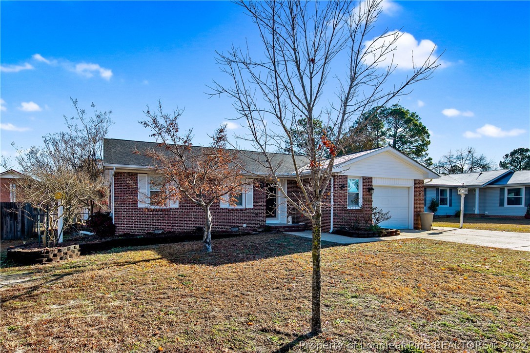 211 Duncan Road Spring Lake, NC 28390 - Photo 2 of 46 a front view of a house with a yard