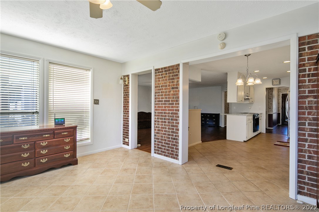 211 Duncan Road Spring Lake, NC 28390 - Photo 26 of 46 a view of an empty room with a kitchen