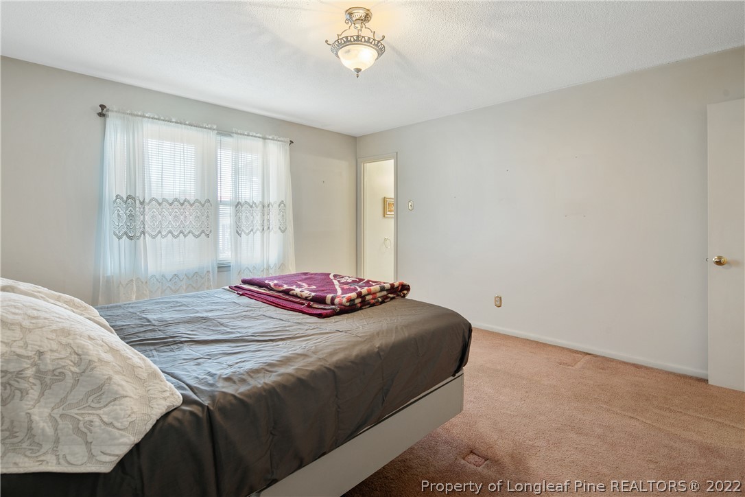 211 Duncan Road Spring Lake, NC 28390 - Photo 28 of 46 a bedroom with a bed and a window