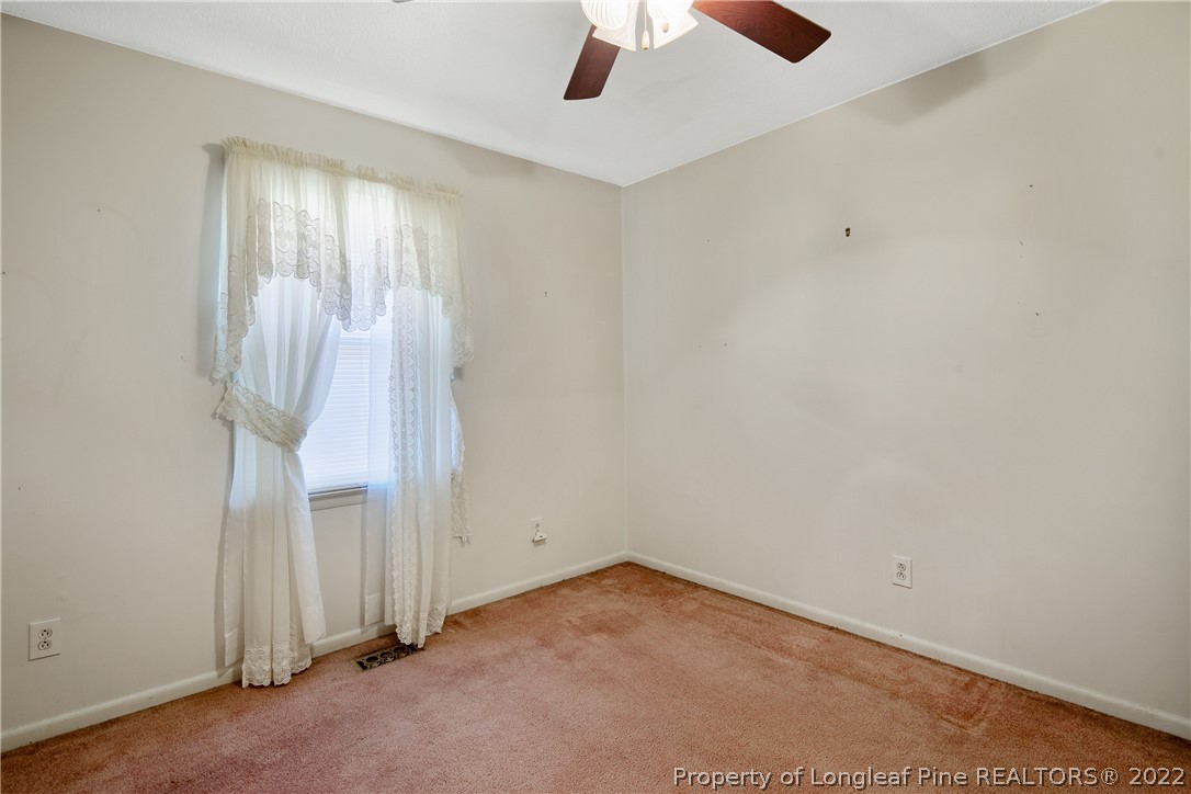 211 Duncan Road Spring Lake, NC 28390 - Photo 33 of 46 an empty room with a door