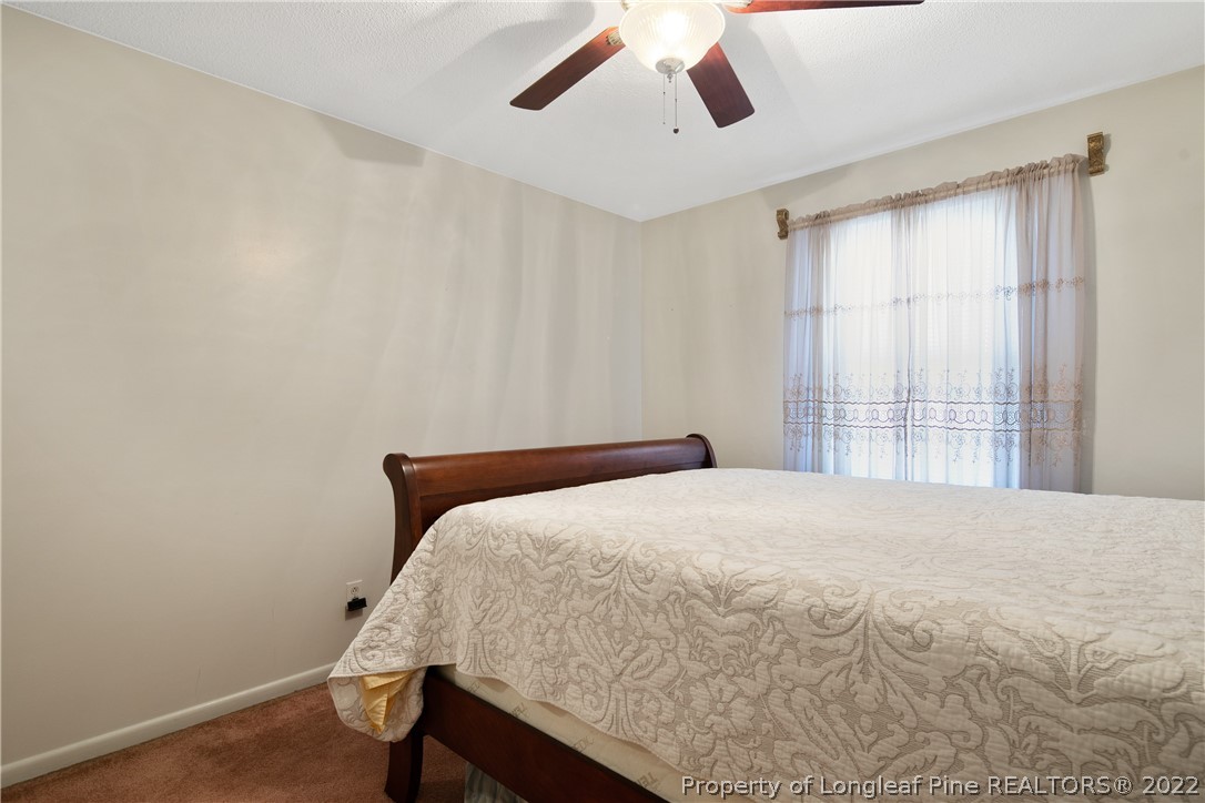 211 Duncan Road Spring Lake, NC 28390 - Photo 40 of 46 a bedroom with a bed and a window