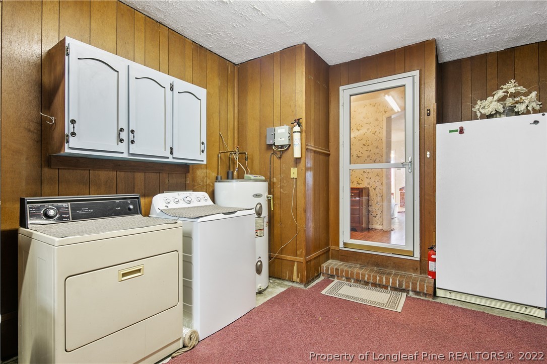 211 Duncan Road Spring Lake, NC 28390 - Photo 41 of 46 a view of a storage and utility room with washer and dryer